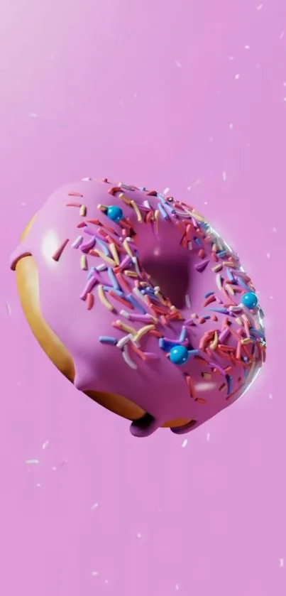 Pink donut with colorful sprinkles on a vibrant background.