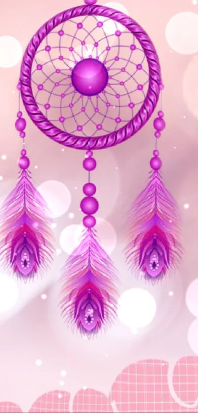 Pink dreamcatcher wallpaper with feathers and bokeh effect.