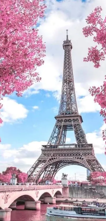 Eiffel Tower with pink blossom trees in scenic view.