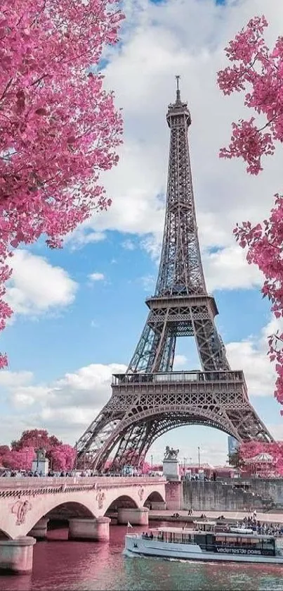 Eiffel Tower spring scene with pink blossoms and a river view.