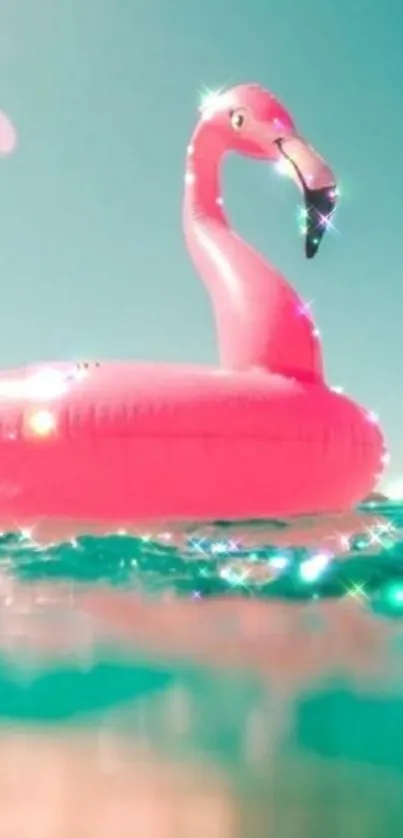 Pink flamingo float on turquoise sea.