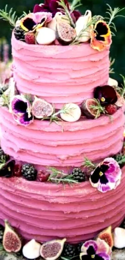 Three-tiered pink cake with floral decorations.