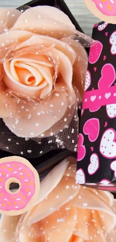 Pink gift box with orange roses and heart patterns.