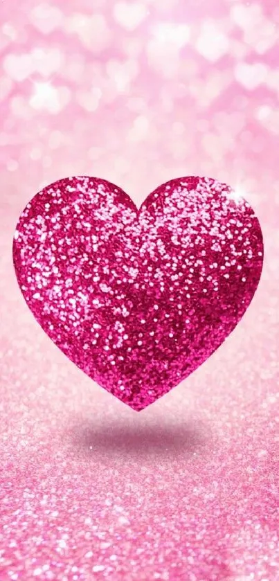 Sparkling pink glitter heart on a matching background.