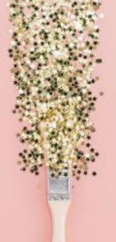 Paintbrush with glitter stars on pink background wallpaper.