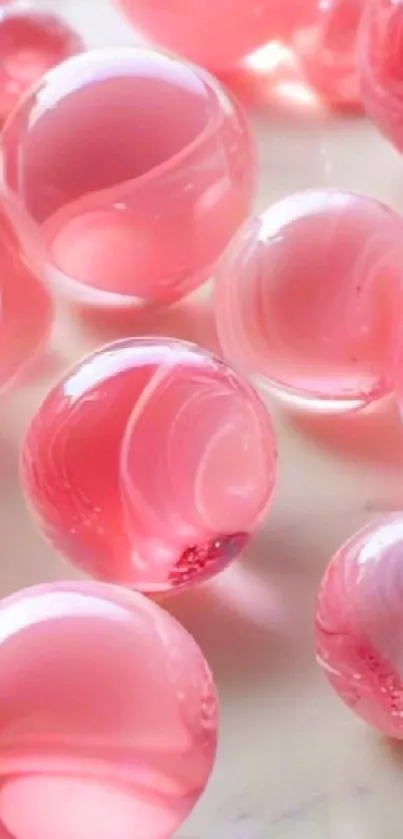 Glossy pink marbles creating a smooth surface.