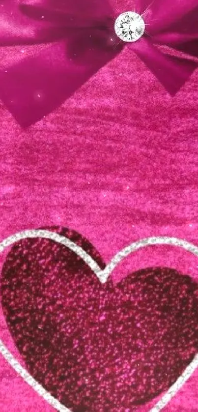 Pink wallpaper with a glittery heart and a satin bow.