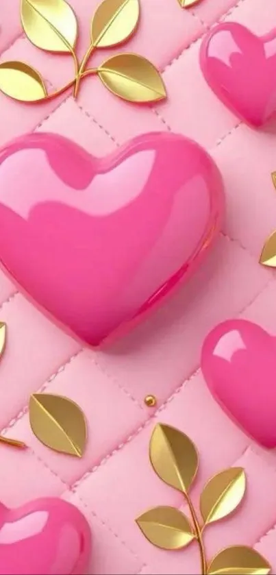 Glossy pink hearts and gold leaves on a pink quilted background.