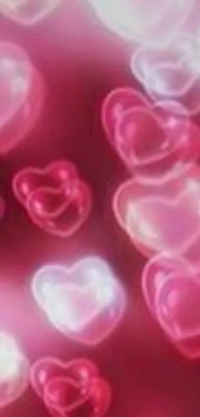 Mobile wallpaper with pink heart bubbles on red background.