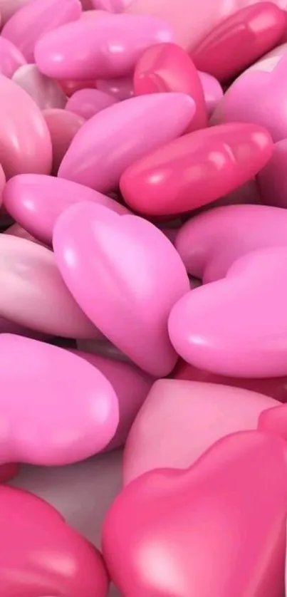 Pink heart-shaped candies fill the screen, creating a sweet and charming wallpaper.