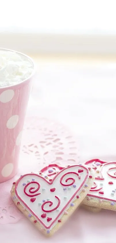 Pink heart cookies and a polka dot mug on a pastel background.