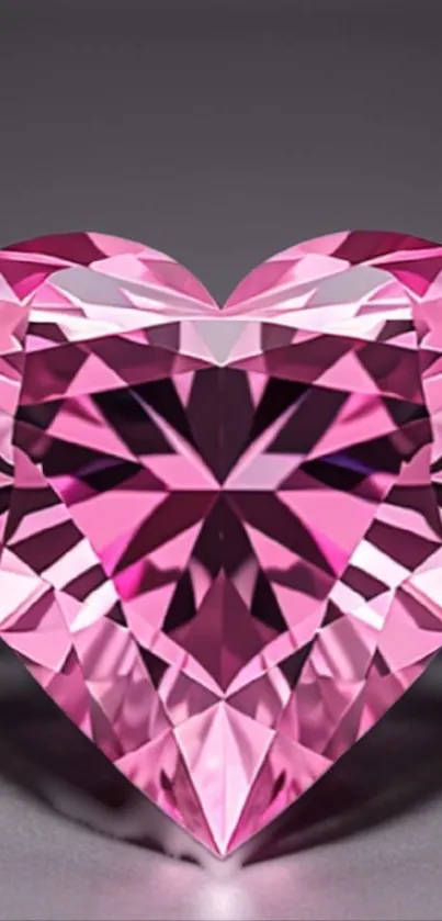 Pink heart-shaped diamond with intricate facets on a mobile wallpaper.