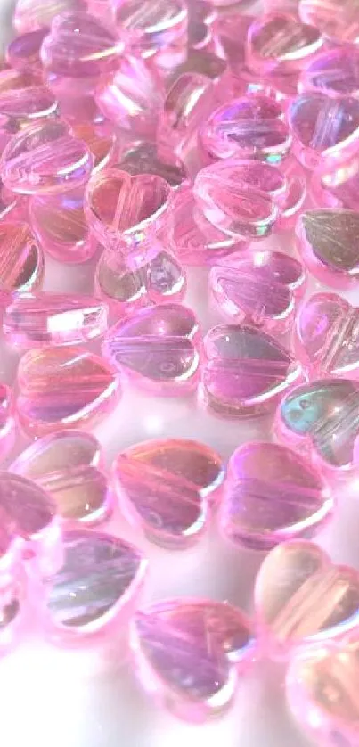 Glossy pink heart-shaped gems on a white plate.