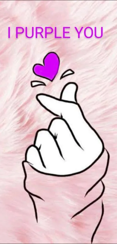 Pink background with a hand heart gesture.