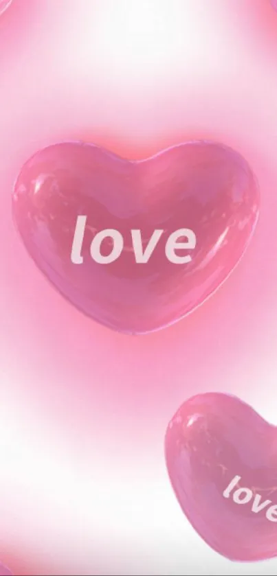 Pink heart with love text on mobile wallpaper.