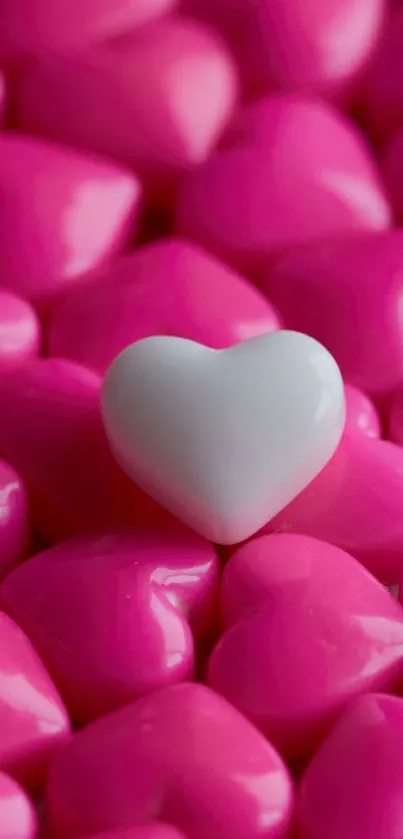 A white heart on pink heart background wallpaper.