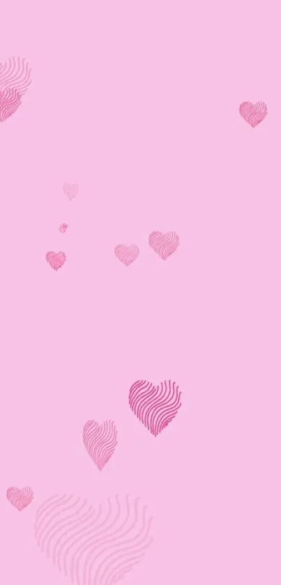 Soft pink wallpaper with fingerprint hearts.