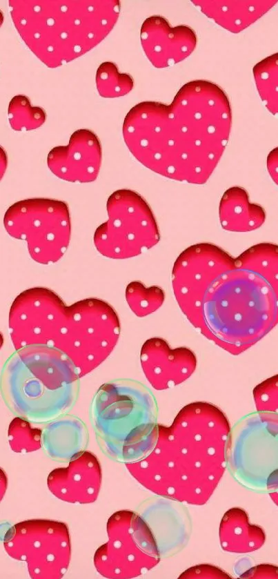 Charming pink polka dot heart wallpaper for mobile devices.