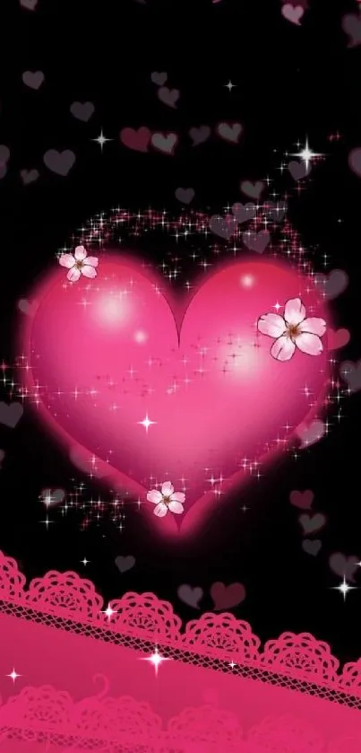 Pink heart with sparkles and floral accents on black background.