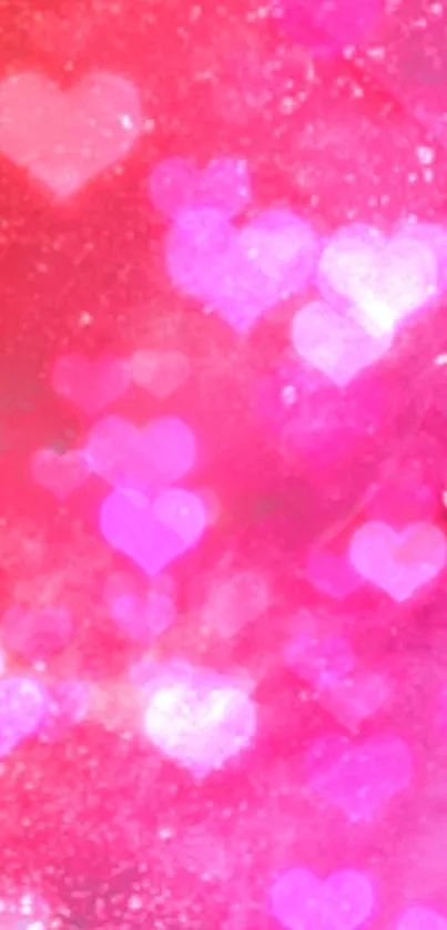 Vibrant pink heart sparkle phone wallpaper with glitter effects.