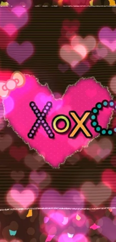 Pink heart wallpaper with XOXO design and bokeh background.