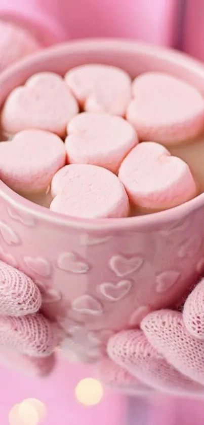 Warm pink mug with heart marshmallows.