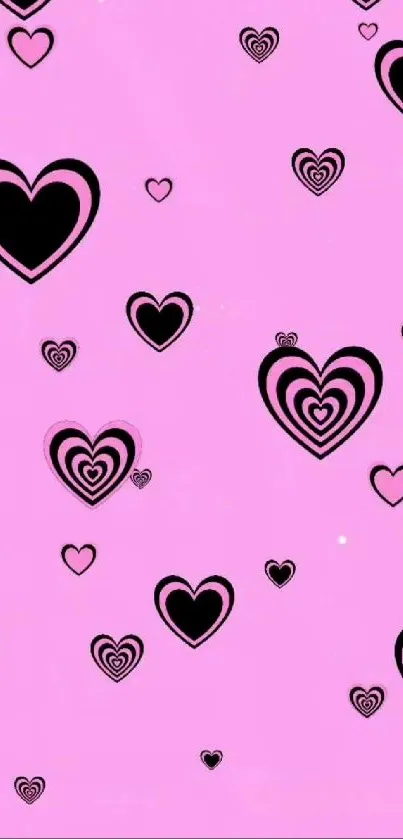 Pink wallpaper with black heart patterns.