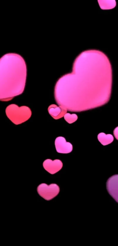 Pink glowing hearts on a sleek black background wallpaper.