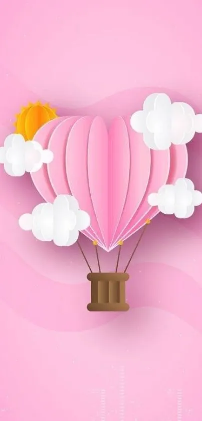 Pink hot air balloon with clouds and sun on a soft pink background.