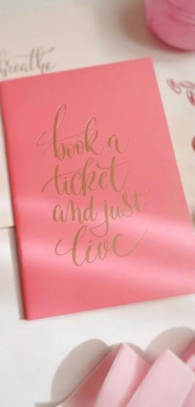 Pink inspirational wallpaper with elegant typography and decorative items.