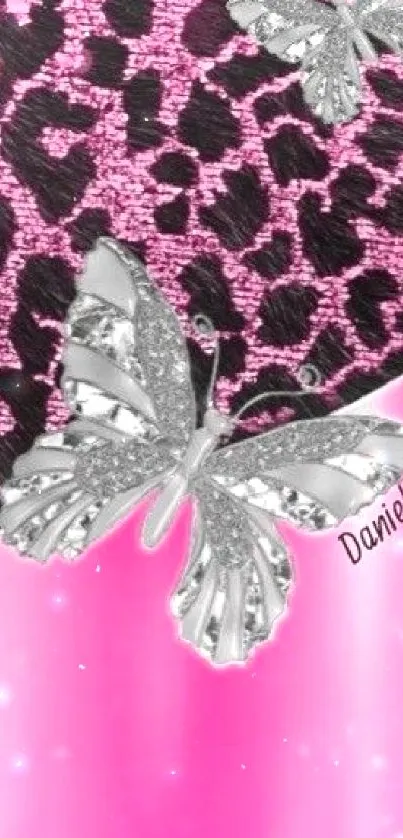 Pink leopard print wallpaper with silver butterflies.