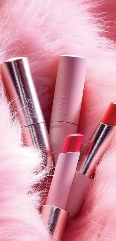 Pink lipsticks surrounded by fluffy fur background.