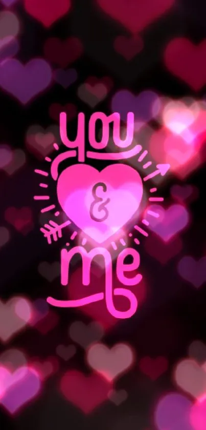 Black wallpaper with pink heart saying 'you & me' symbolizing love.