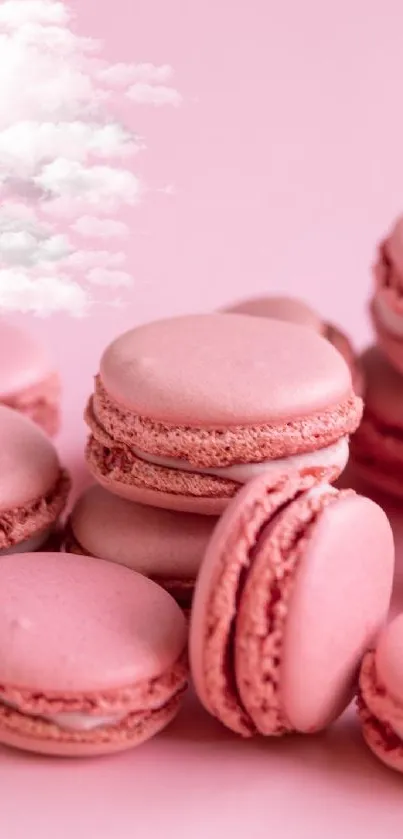 Pink macarons with a cloud background, perfect for a sweet phone wallpaper.