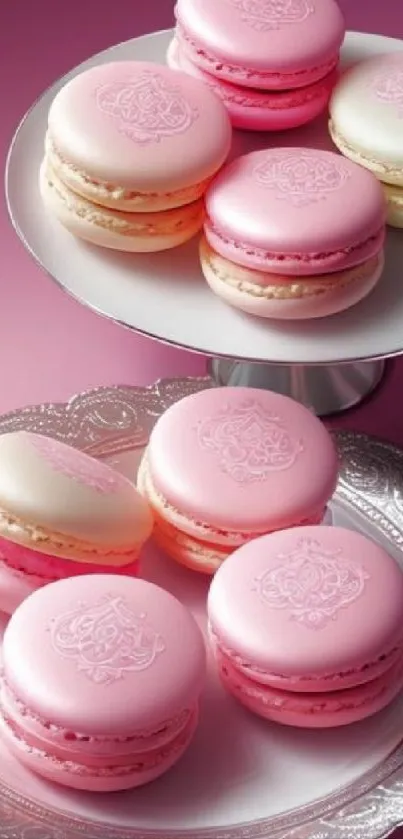 Pink macarons on elegant silver platters, perfect for a mobile wallpaper.