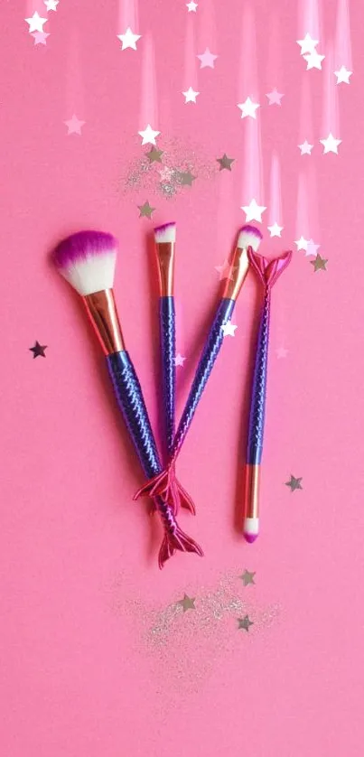 Pink background with colorful makeup brushes and stars.