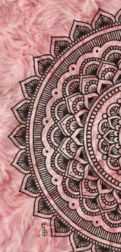 Intricate mandala on pink fur background.