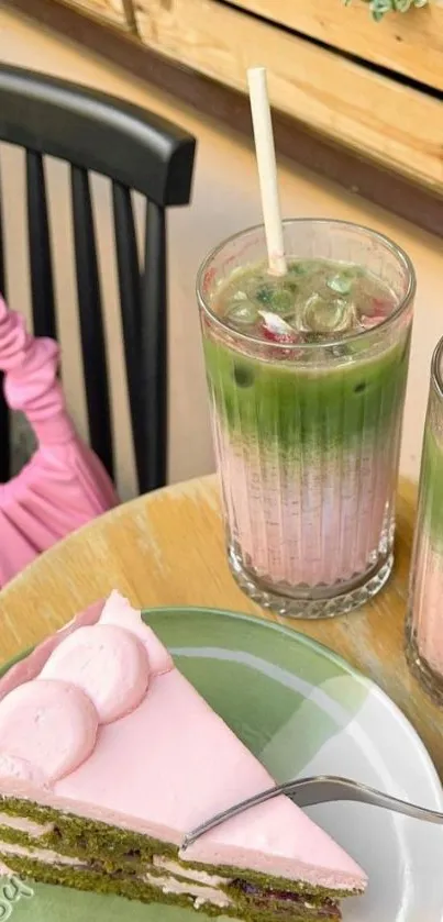 Slice of pink cake with matcha latte in a cozy outdoor setting.