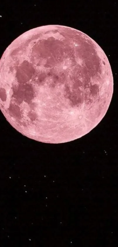 Pink full moon against a black starry sky.