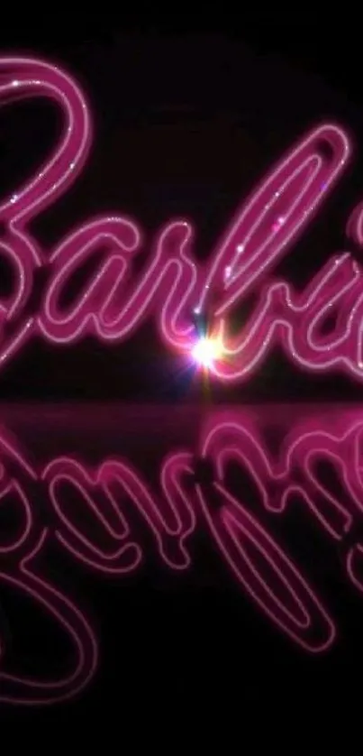 Pink neon cursive writing with a reflective glow.