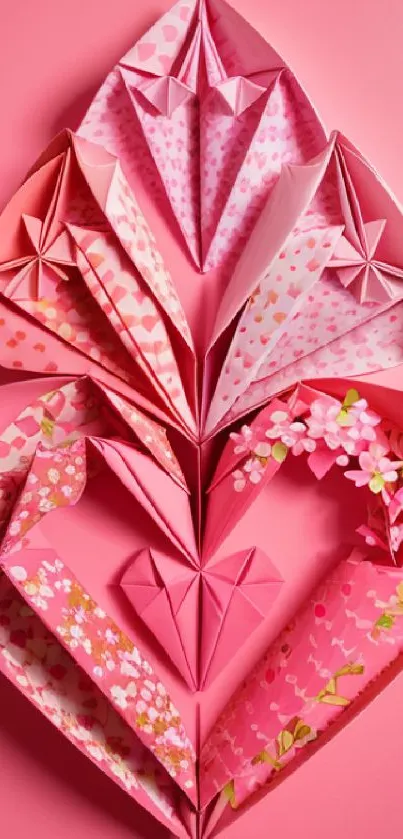 Pink origami art with floral patterns on a vibrant wallpaper.