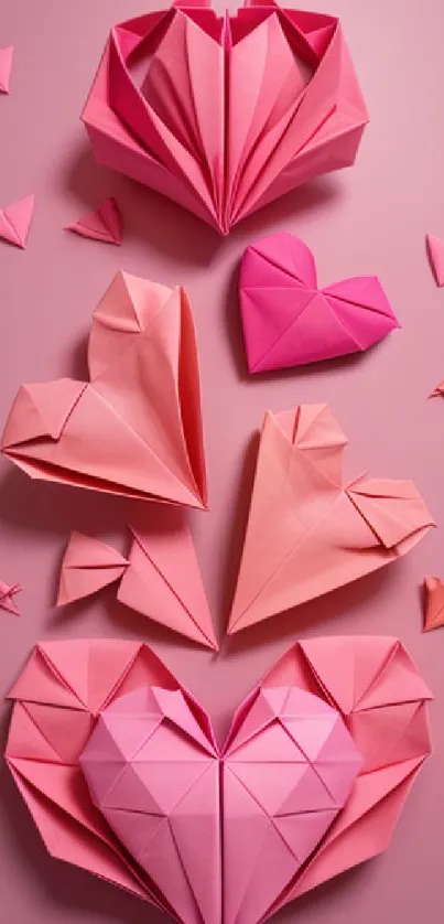 Pink origami hearts on a soft pink background create a serene mobile wallpaper.