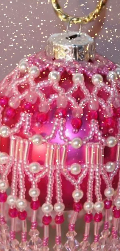 Pink ornament with pearls and glitter background.