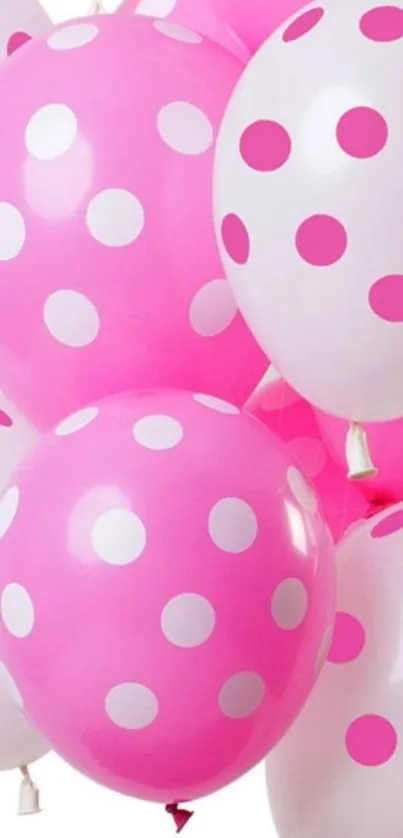 Pink polka dot balloons create a vibrant and playful wallpaper.