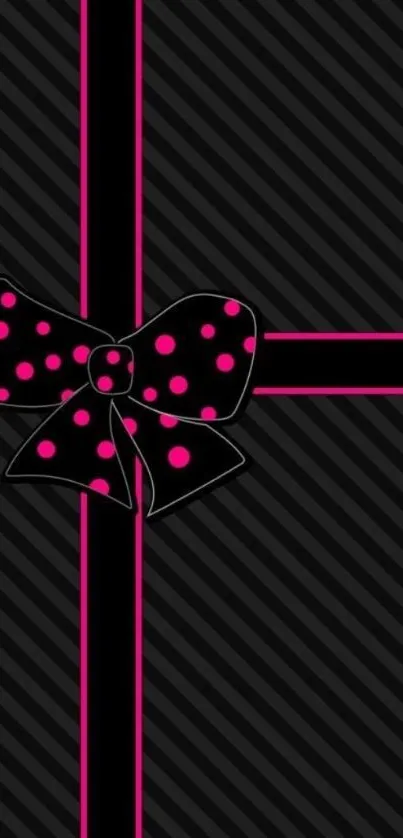 Stylish black mobile wallpaper with pink polka dot bow accent.