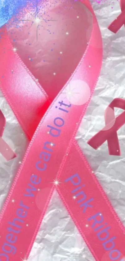 Pink ribbon on textured background symbolizing cancer awareness.