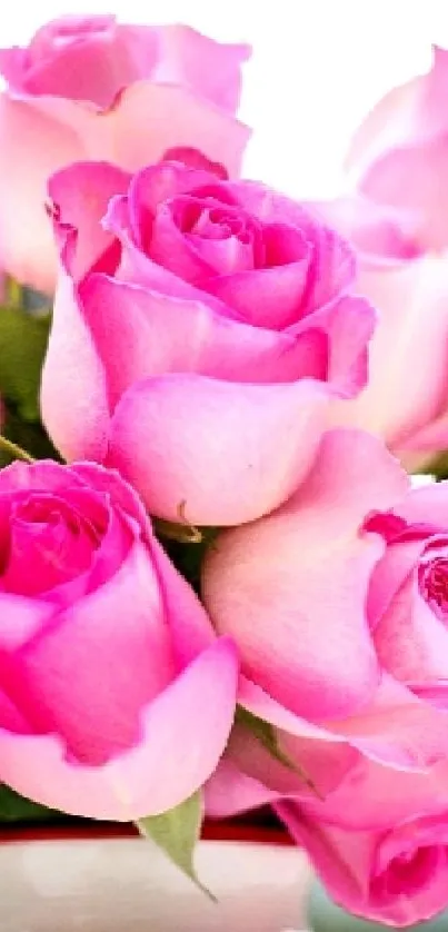 Mobile wallpaper featuring a bouquet of vibrant pink roses, elegantly arranged.