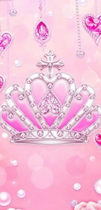 Pink crown and heart jewels on rosy background.