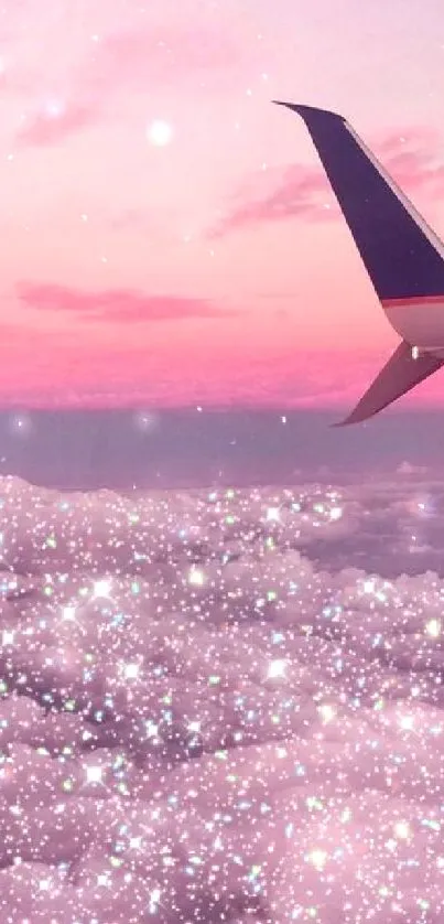 Plane wing overlooking a pink starry sky and clouds.