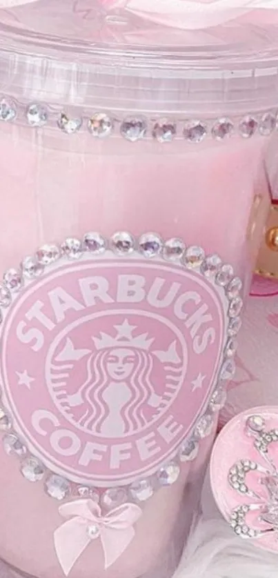 Elegant pink Starbucks cup with jewel decorations.